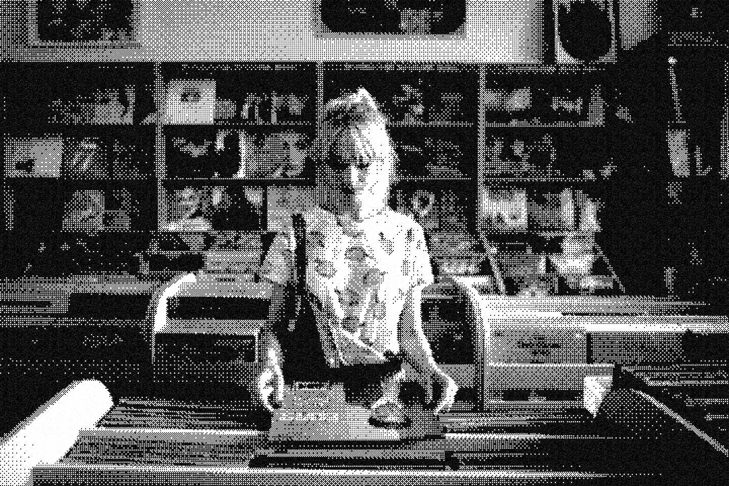 A performer at a record store, illuminated in halftone.
